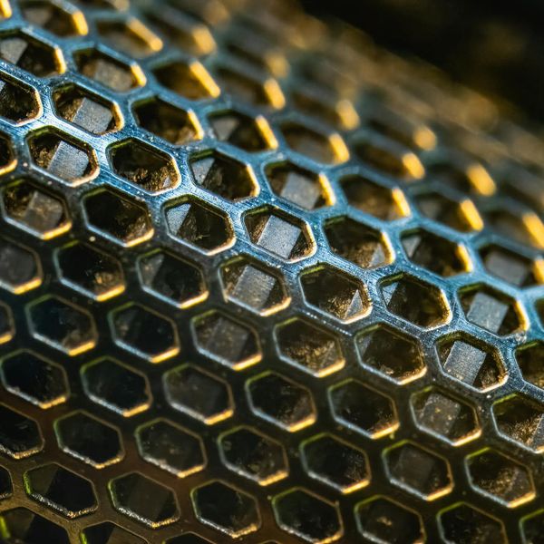 Glowing green geometric patterns symbolizing structural integrity and health